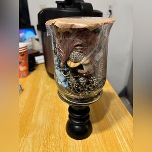 Mystery jewelry in candle holder